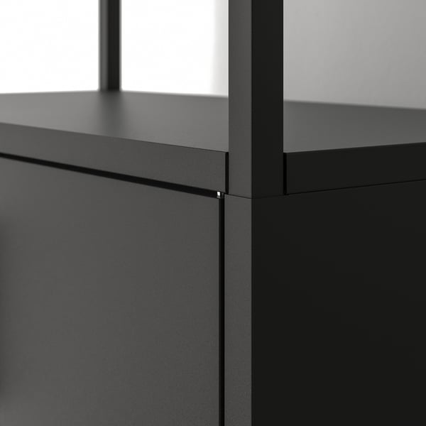Modern black metal shelf unit with sleek, adjustable storage. High-quality steel construction for durability.
