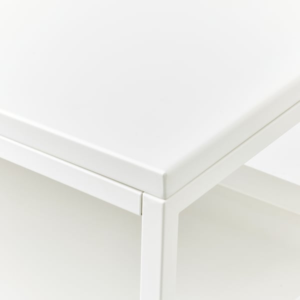 Close-up of white, clean, well-constructed furniture corner, showcasing smooth finish and sturdy design.