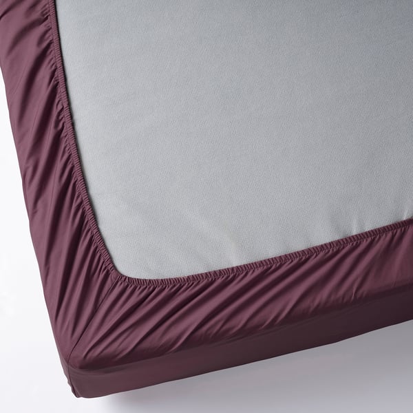 A fitted sheet with elastic edges, dense weave, and soft texture for durability and breathability.