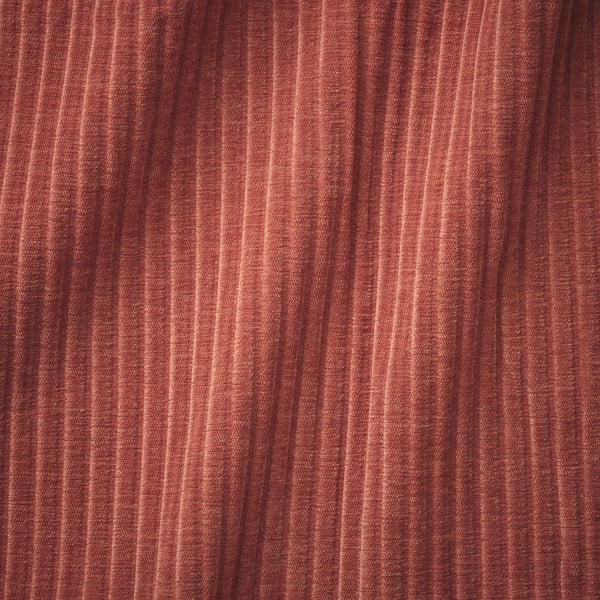 Close-up of burgundy fabric with subtle stripes, soft and plush texture, likely high-quality sofa material.