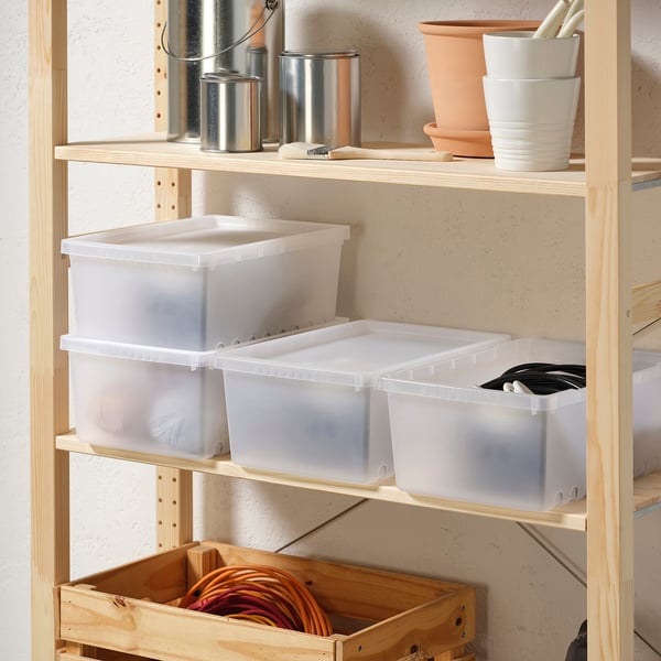 Shelf with clear plastic UPPSNOFSAD boxes and other items.
