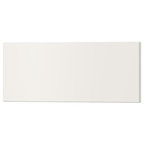 Displays a rectangular white UTRUSTA drawer front made of acrylic-painted fiberboard.