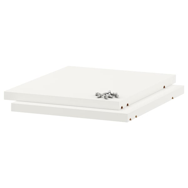 Two white ikea UTRUSTA melamine shelves, thick and sturdy, ready for assembly.