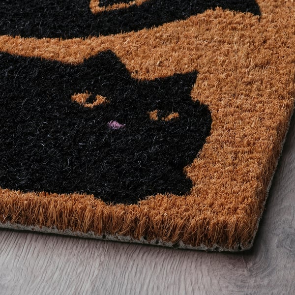 Doormat with black cat design.