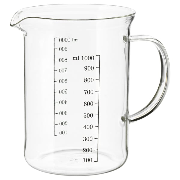 Clear glass measuring jug with handle and markings for measuring liquids.