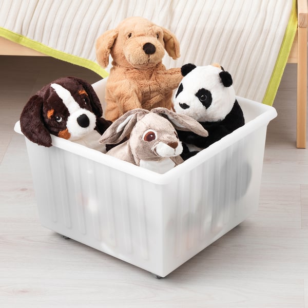 White storage crate with wheels holds plush toys, easy to carry by top edge.