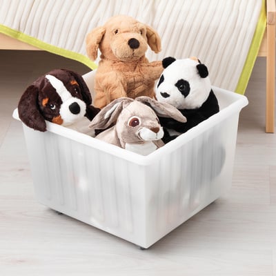White storage crate with wheels holds plush toys, easy to carry by top edge.