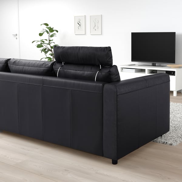 VIMLE black sofa with headrest, modern design, fits well in living space.