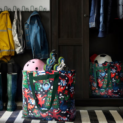 Colourful VINTERFINT bags: pink with kids gear, other with football ball.
