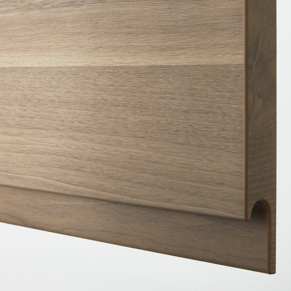 Close-up: sleek, dark walnut textured cabinet door with integrated handle, smooth finish.
