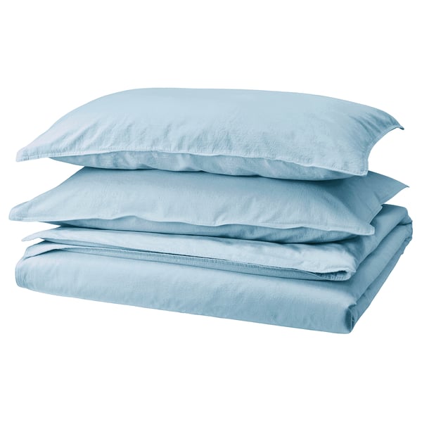 Light blue bedding set, neatly folded, made of cotton, featuring smooth texture and natural design.