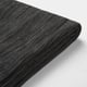Black sofa cushion cover, tightly folded, smooth fabric texture.
