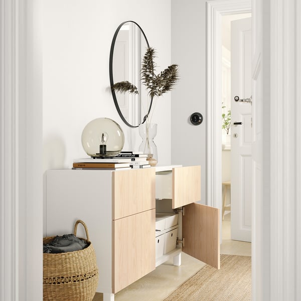 Modern hallway with BESTÅ sideboard, mirror, lamp, and basket.