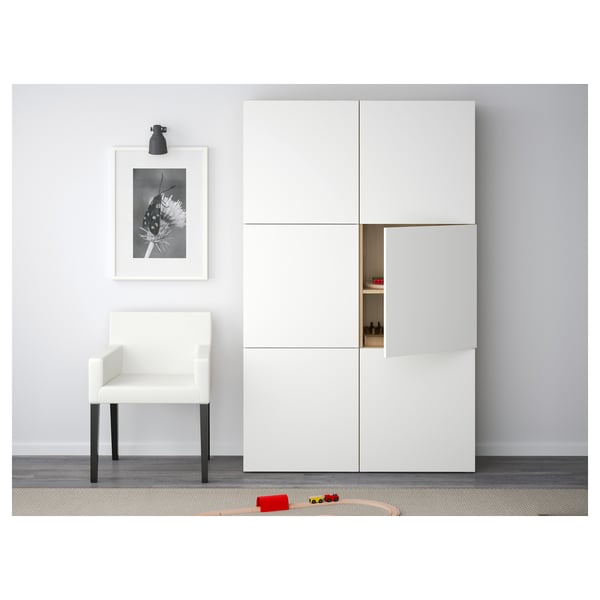 Minimalist room with white furniture, open cupboard, toy car, flower photo.