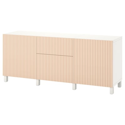 A white BESTÅ sideboard with light wood panel doors and metal legs.