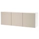 White BESTÅ wall unit, three beige doors, simple and clean design.