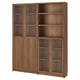 A BILLY wooden bookcase with glass doors. Its brown, has adjustable shelves, and a sturdy design.