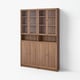 Wooden BILLY bookcase, light brown, six shelves, some glass doors, simple rectangular design.