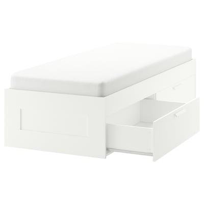 Depicts a white BRIMNES bed frame with integrated drawers and adjustable sides. It is designed for compact spaces and easy assembly.