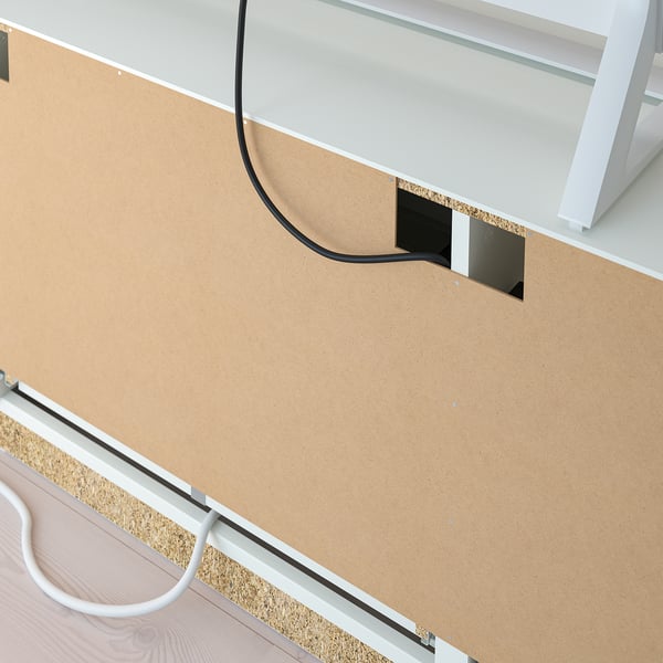 White tv bench with smooth drawers and cable management holes.
