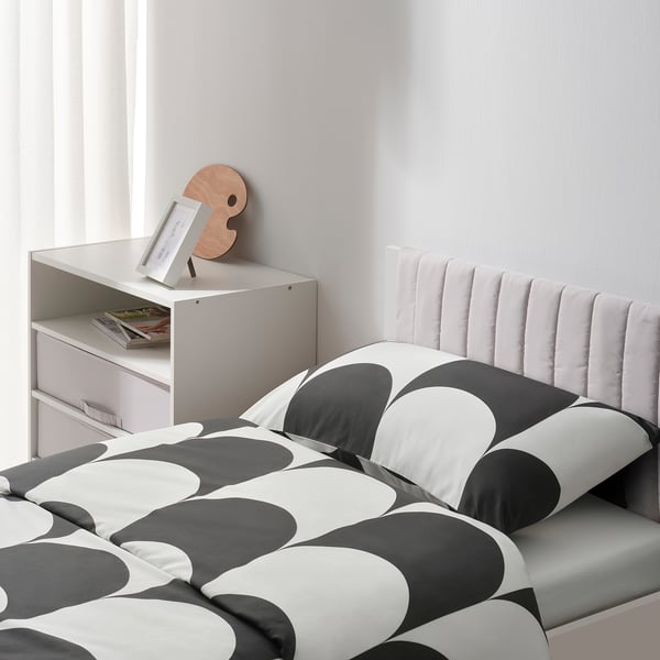 A modern bed frame with a cushioned headboard and storage underneath, ideal for a cosy and organised bedroom.