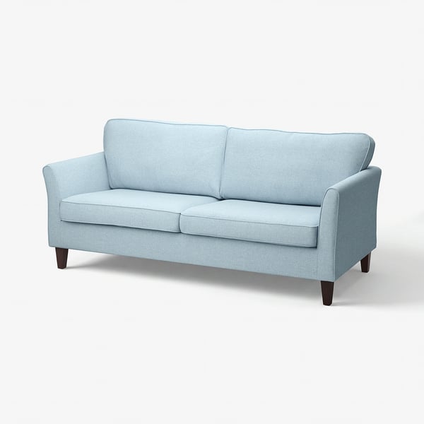A light blue EKHOLMA sofa with a modern design, wooden legs, and plush cushions.