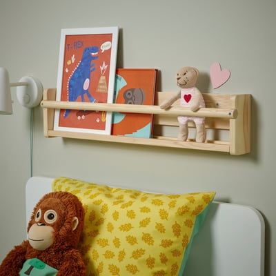 Kids shelf with books & toys. Monkey on bed with leaf pillow.