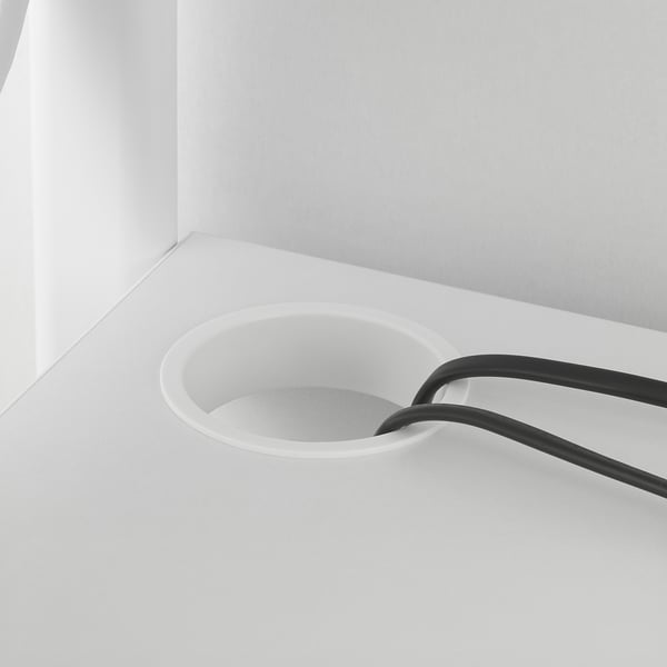 Desk with wrist support and cup holder.