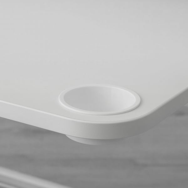 Gaming desk with built-in cup holder for convenience.