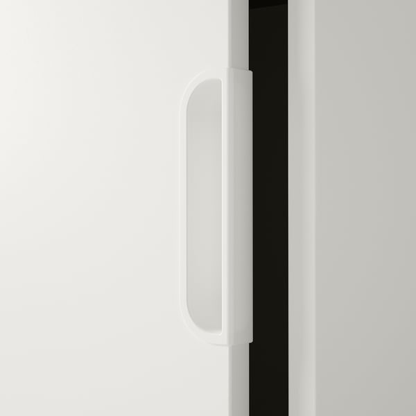 Close-up of sleek, smooth white door handle on modern cabinet, displaying sleek design and quality finish.