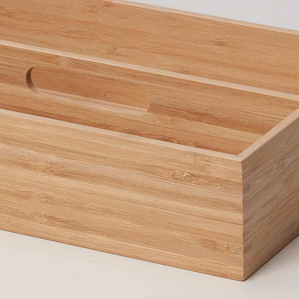 Wooden storage tray with handles, crafted from bamboo. Handed, fits neatly on tables or in drawers.