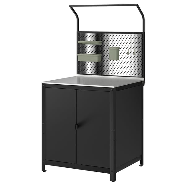 A black GRILLSKÄR outdoor kitchen unit with a stainless steel countertop and shelves. It has a modern design and a perforated back panel.