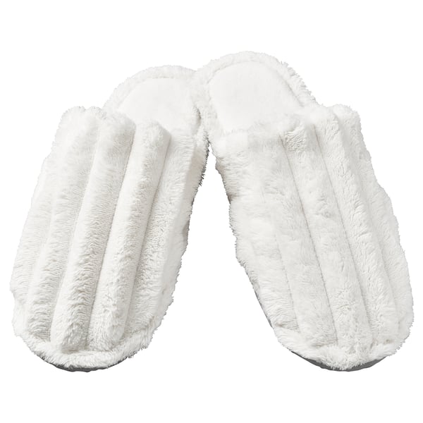 Two white fuzzy slippers, open-toe, plush design.