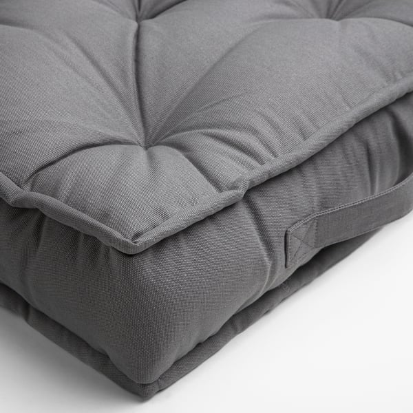 Soft, grey, large floor cushion with handles; high-quality design.
