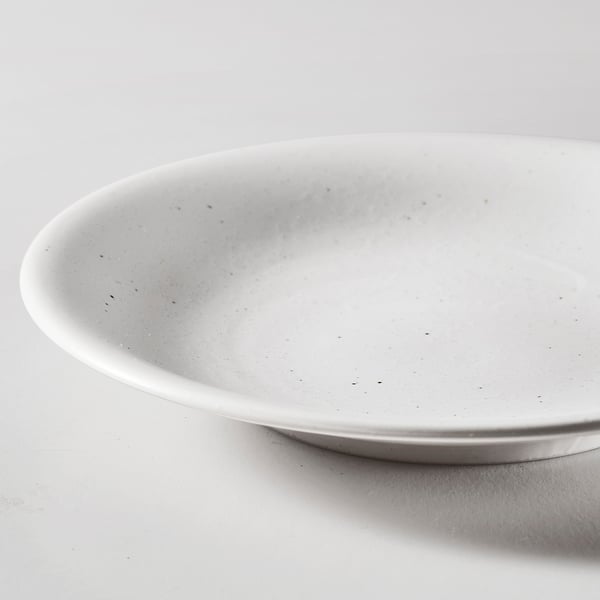 Lightweight, durable bowl with a smooth, glossy finish. Shallow edges and simple design, perfect for everyday use.