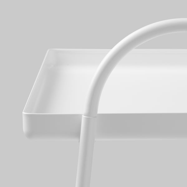 Close-up of modern white table with sleek design and high edges.