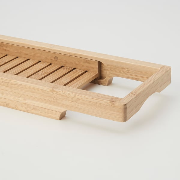 Wooden bath tray, handcrafted with smooth finish. Adjustable for tub width, ideal for bathroom essentials.