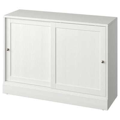 A white HAVSTA sideboard made from solid pine, featuring sliding doors and a rectangular design.