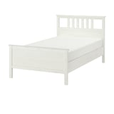 White HEMNES bed, wooden, rectangular, minimalist design.