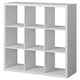 A white KALLAX storage unit with nine open cube compartments. It has a modern, minimalist design, perfect for displaying or storing items.