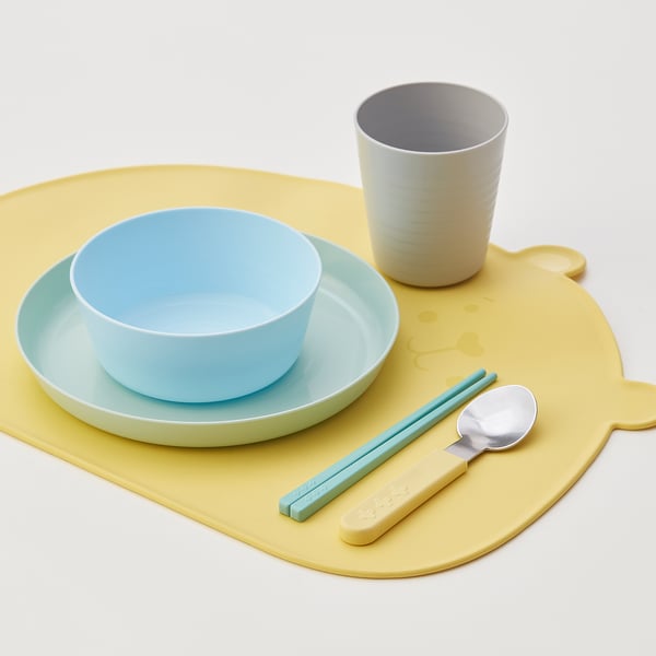 KANONKUL yellow silicone placemat with blue bowl, grey cup, and kids utensils. Oversized, bright, and practical for kids mealtime.