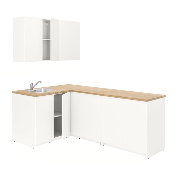 A white KNOXHULT kitchen set with light wood countertop and stainless steel sink.