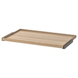 An ikea KOMPLEMENT pull-out tray in light oak color, designed for wardrobe storage, with a wooden and metal design.