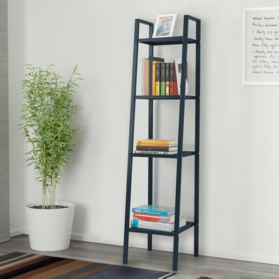 LERBERG bookshelf with varying depth shelves, plant, books, white wall.