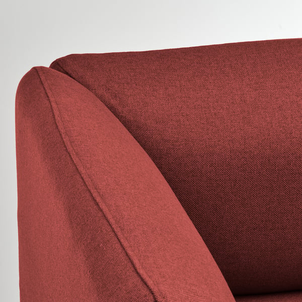 Close-up of LILLEHEM sofas plush, red fabric, showcasing its clean lines and comfortable padding.
