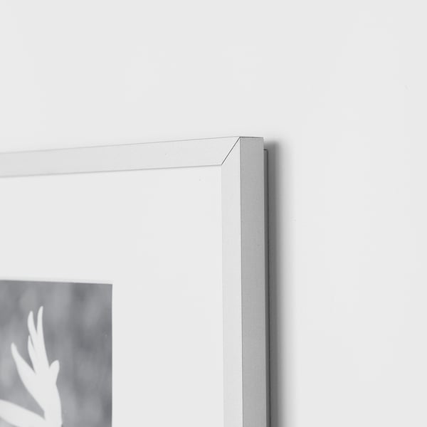 Close-up of sleek, high-quality frame corner, showing thin metal edge and front protection. Modern, minimalist design.