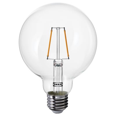 Ikea LUNNOM bulb, clear glass, spherical shape, warm white light.