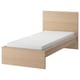 Oak MALM bed with white mattress, high headboard, and slatted base.