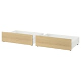 Two white MALM storage drawers with wooden fronts, designed for smart under-bed storage.