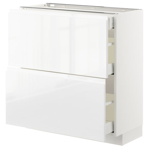 White modern kitchen cabinet with sleek design and integrated handles.